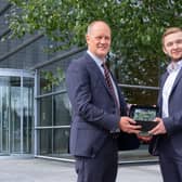 Alex Olsen from Portadown receives the Almac McKervey Award for Excellence in Organic Chemistry' and a £1,500 bursary towards his tuition fees from Dr Stephen Barr, Managing Director and President, Almac Sciences and Almac Discovery.