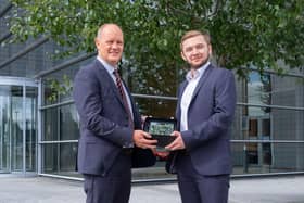 Alex Olsen from Portadown receives the Almac McKervey Award for Excellence in Organic Chemistry' and a £1,500 bursary towards his tuition fees from Dr Stephen Barr, Managing Director and President, Almac Sciences and Almac Discovery.