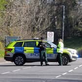 Police at the scene of the earlier security alert, which has now ended. Picture by  PressEye