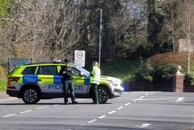 Police at the scene of the earlier security alert, which has now ended. Picture by  PressEye