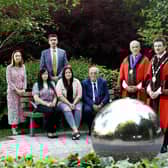 Standing left to right are: LCCC Director of Finance & Corporate Services, Cara McCrory; The Mayor’s Chaplain, Rev Roger Higginson; Councillor Uel Mackin; LCCC Mayor, Councillor Scott Carson. Seated: Julie and Trevor Kirkwood and their daughter Kirsty (centre).