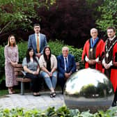 Standing left to right are: LCCC Director of Finance & Corporate Services, Cara McCrory; The Mayor’s Chaplain, Rev Roger Higginson; Councillor Uel Mackin; LCCC Mayor, Councillor Scott Carson. Seated: Julie and Trevor Kirkwood and their daughter Kirsty (centre).