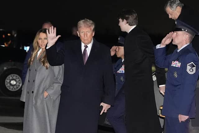 President-elect Donald Trump and Melania Trump arriving at Dulles International Airport on Saturday. Trump's inauguration takes place in Washington on Monday