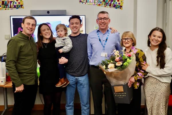 Raymond celebrates his retirement with his family, including granddaughter Penny. Pic credit: SEHSCT
