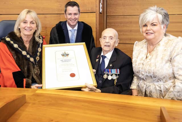 Thomas Doherty receiving his certificate declaring his new status as Freeman of the City of Lisburn and Castlereagh with (L-R) Mayor, Ald Amanda Grehan; LCCC chief executive, David Burns and daughter Lynn Kirk. Photo: McAuley Multimedia Ltd