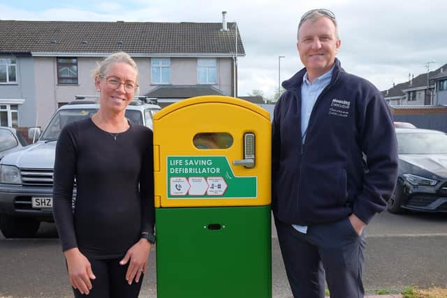Coolnafranky Park Residents Chair with Housing Executives's Shane Conlon at the New Defibrillator.