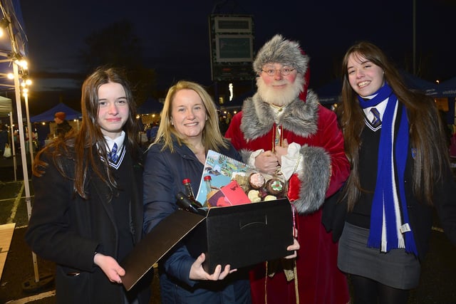Aimee Doherty, Marie-Therese Norris, and Brenda Poland who won a Christmas hamper at the Carryduff Christmas Market
