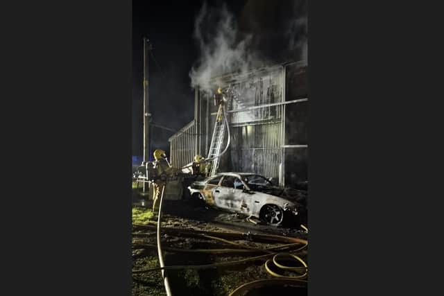Fire damaged cars and sheds in the Scotch Street area of Portadown last night.