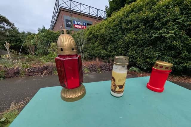 Candles which have been lit in memory of Igors Gavrilovs, who died following an incident in Fisher Park on Saturday.