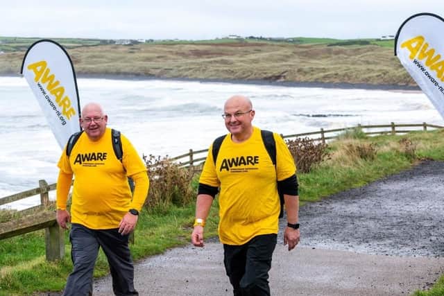 Colin Ellis (R) is accompanied by his friend, Philip Hartin (L), after his first meeting during the inaugural Giant Steps event in 2022. CREDIT AWARE NI