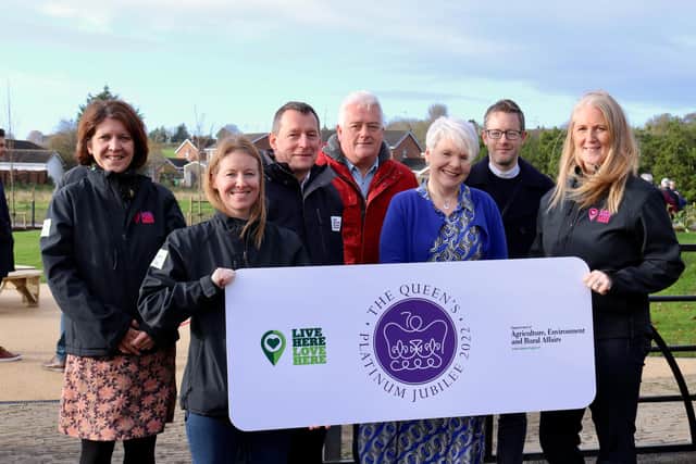 Celebrating the opening of the new community garden are members of Live Here Love Here, Department of Agriculture, Environment and Rural Affairs and Magheralin Parish Church.