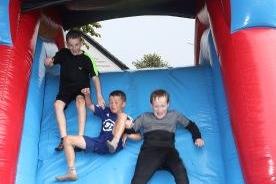 Enjoying the inflatables at the Rathcoole fun day.