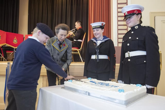 Princess Anne cutting the commemorative cake.