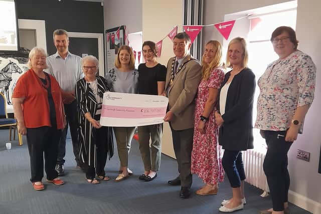 Pictured, left to right, at the Carnlough Community Association funding presentation are: Mary Watson, Secretary; Danny Donnelly MLA; Patricia McConnell, chairperson; Claire Mulholland, principal, Carnlough Controlled Integrated Primary School; Amy O’Neill, administrator, the outgoing Mayor of Mid and East Antrim, Noel Williams; Gillian Irvine, funding manager, National Lottery Community Fund; Joanne McIlhatton, programme co-ordinator and Councillor Maureen Morrow.
