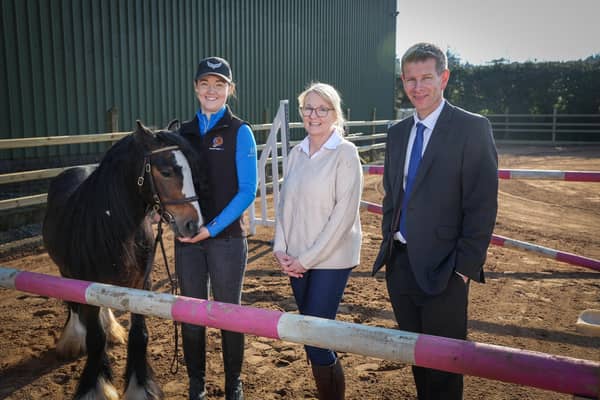 Ulster Bank business development manager Neill Boyd pictured with Megan and Gillian McOuat, owners of Moorestown Equine Services, and Traditional Gypsy Cob Kenny (aka Moorestown Early Dawn). Photo: MATT MACKEY