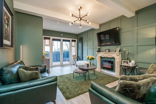 Family room with panelled feature wall.