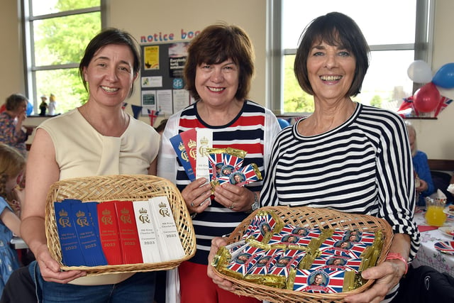 Coronation Chocolate and book marks were given out by Loughgall And District Improvement Association committee members, Claire Sleeth, Denise Gilpin and Florence Anderson. PT18-272.