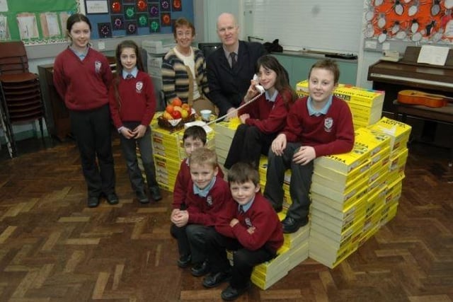 Barry Tapster called to Upper Ballyboley Primary School in 2007 to present them with their prize for the best Yellow Pages sculpture. He's pictured alongside principal Mrs Ferguson and some of the pupils with their table and chair sculpture.