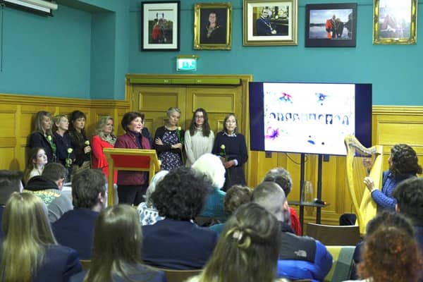 Mahin Gornall introducing the names of the young women listed below, as a rose is placed in vase in remembrance of their courage. Derry Guildhall in January in the presence of the Mayor, Cllr Patricia Logue. Credit: Supplied