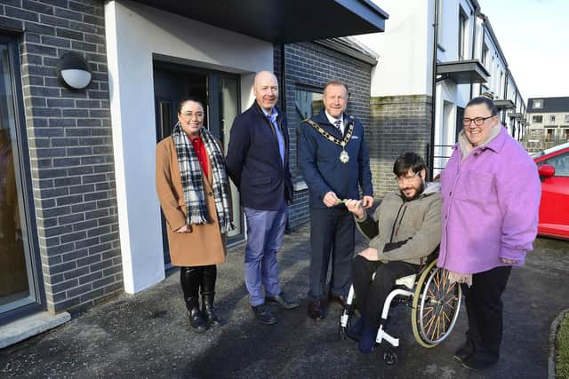 Ald Stephen Ross is joined by Greg Woods and Rachel Clarke from Arbour Housing and Andrew and Helen Ryan as they receive the keys to their new accessible bungalow.