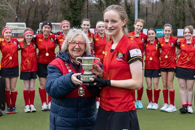 U14 Captain Hannah Carswell receiving the cup.