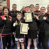 Irish champions, Isaac Ireland and Bryan Ward, celebrate with Banbridge Boxing Club’s coaching team.
