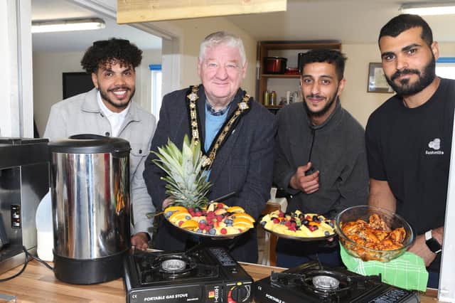Members of Portstewart Men’s Shed welcome Mayor of Causeway Coast and Glens, Councillor Steven Callaghan, being shown the various activities the group offer including the recently launched ReCycle bicycle project. Credit Causeway Coast and Glens Council