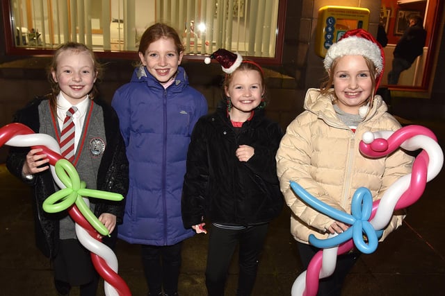 Big smiles at the Christmas lights switch on at the Mayfair Business Centre, Garvaghy Road, from, Grace Hughes (9), Teri O'Connor (9), Cara Gallagher (8) and Róise Farrell (9). PT50-257.