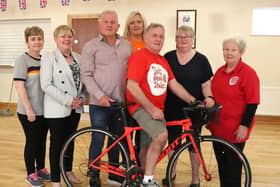 Martin McLean, centre, who presented a cheque for £1,290 to Elizabeth White, Ambassador, NI Chest Heart and Stroke and Dian McFadden, Ballycastle Support Group and a cheque for £1,290 to Heather Gott, Fundraising Manager, MS. Included are Martin's wife Ann and family members Sharon McKillop and Stephen McKillop.