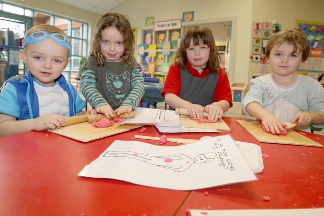 Triston Kidd, Kaley Coulter and Rosie, prospective Moira Primary 1 pupils play with P2 pupil Anna Brown during the open day in 2008