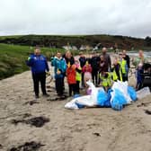 The group of Beach Clean volunteers at Browns Bay.  Photo: Elena Aceves-Cully