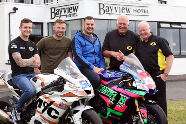 Bill Kennedy MBE hands over the baton to William Munnis and wishes him and the Club every success. Credit Pacemaker Press