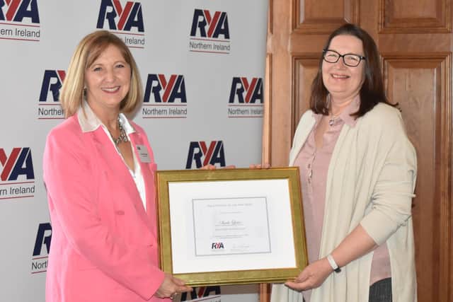 Sheela Lewis (right) is presented with her award by Susan McKnight, chair of the RYA Northern Ireland.