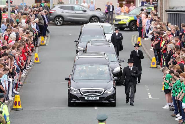 Mourners in Maguiresbridge. Picture by Jonathan Porter/PressEye