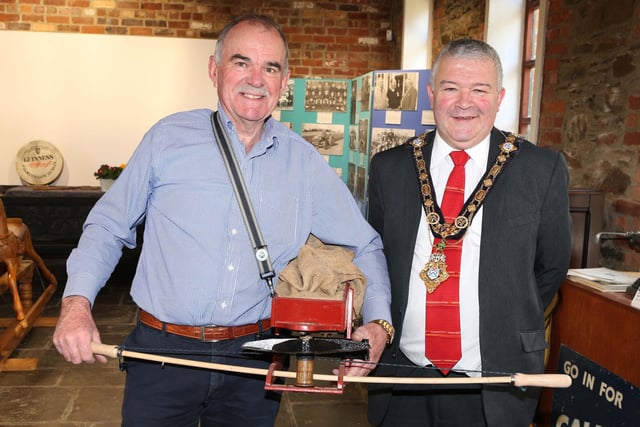 Mayor Cllr Ivor Wallace with Sam McCrae who is lending a seed fiddle to the Green Lane Museum