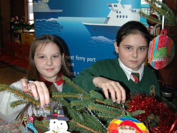 The winners of the Port of Larne Christmas tree decoration competition hang their decorations on the tree in 2006. LT51-329-PR