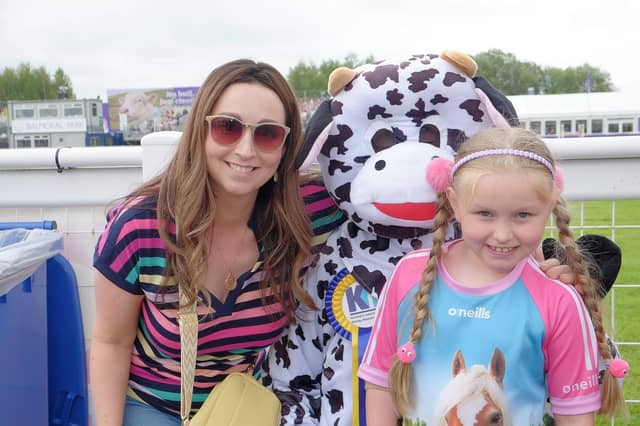 Northern Ireland Kidney Research Fund 's mascot Bella the Kidney Cow with Emily and Lisa Glenn from St Johnston, Donegal