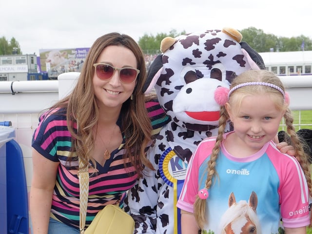Northern Ireland Kidney Research Fund 's mascot Bella the Kidney Cow with Emily and Lisa Glenn from St Johnston, Donegal