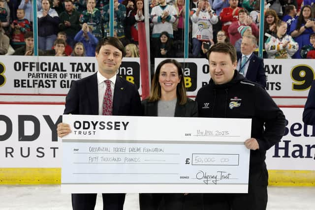 Georgii Zubko, President of the Ice Hockey Federation of Ukraine & Director of Ukrainian Hockey Dream; Claire Cosgrave, Head of Arena Experience at The Odyssey Trust; James Glover, Operations Manager at The Odyssey Trust. Tonight the Belfast Giants All Stars and Dnipro Kherson competed in a charity ice hockey game in support of Ukrainian Hockey Dream. After the game, a cheque for £50,000 - the total sum raised so far, was presented to Georgii Zubko. A further donation from additional fundraising activities is to be announced in due course. Picture: Press Eye