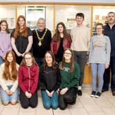 Causeway Coast & Glens Borough Council Mayor, Councillor Ivor Wallace, Nic Wright, Museum Services Community Engagement Officer and Gerard McIlroy, Good Relations Officer alongside the young musicians who performed at the Shared Music of Dalriada event in Flowerfield Arts Centre, Portstewart.