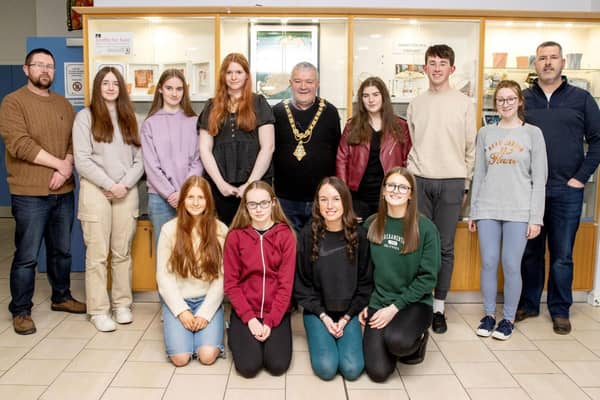 Causeway Coast & Glens Borough Council Mayor, Councillor Ivor Wallace, Nic Wright, Museum Services Community Engagement Officer and Gerard McIlroy, Good Relations Officer alongside the young musicians who performed at the Shared Music of Dalriada event in Flowerfield Arts Centre, Portstewart.