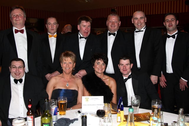 Former All Star Paul 'Humpy' McKillen (2nd right back row), and his guests at the  McQuillans GAC Centenary Gala dinner in the Marine Hotel Ballycastle in 2007