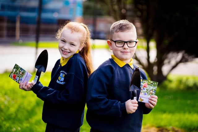 Pupils from Abbots Cross Primary School with their Coronation trowels and wildflower seeds.