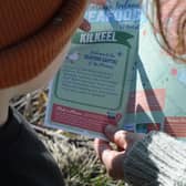 A seafood adventurer using a trail map.