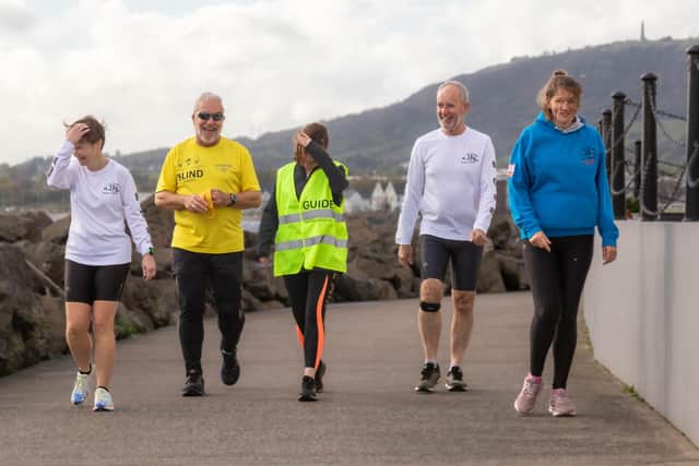 Tony Barclay (second from left) with running friends along Carrickfergus seafront.