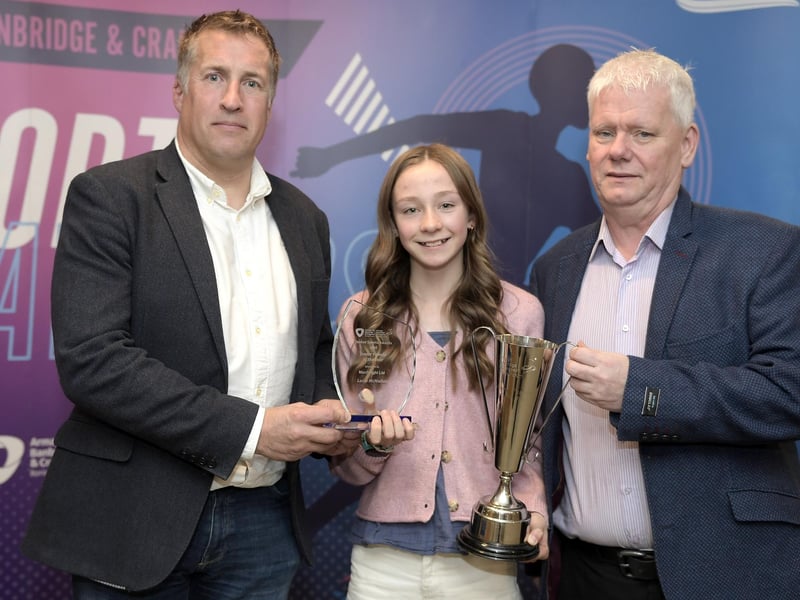 Junior Female sponsored by Manfreight Limited. Award winner: Lucia McMullan (Dromore Athletics Club & Lurgan Junior High School). Presented by: Stephen Marshall (Manfreight Limited) & Seamus McGrath (ABC Sports Forum).