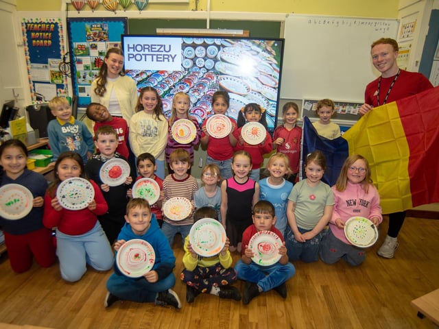 P3 pupils who represented Romania on Culture Day are pictured with teacher, Matthew Cupples and classroom assistant, Rebecca Kelly.