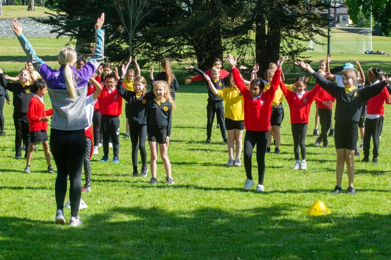 Pupils from Presentation Primary School and Hart Memorial Primary School taking part in dance exercise in Portadown People's Park during the schools' Shared Education exercise, sports skills and picnic event. PT23-237.
