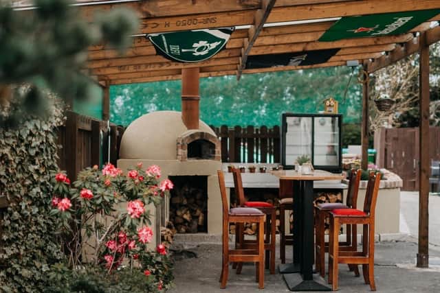 The beer garden at Sally McNally's in Portadown even features an outdoor stove where you can order one of their iconic handmade pizzas.. Picture: Sally McNally's via Facebook.