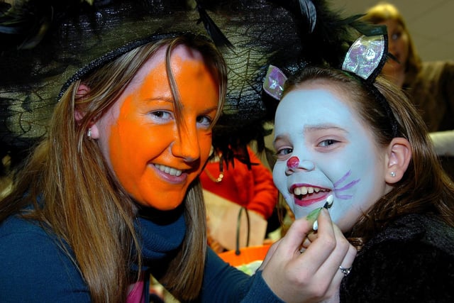 Laura Fleming puts the finishing touches to Taylor Rooney's face at the family Halloween party held at Copeland in 2007.